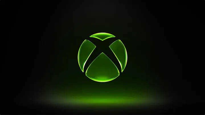 A glowing green Xbox logo floating in the middle of a black background